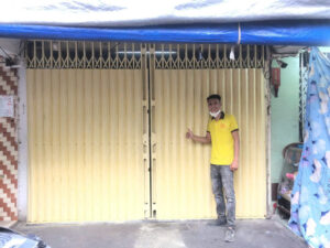 bàn giao sơn cửa sắt kéo